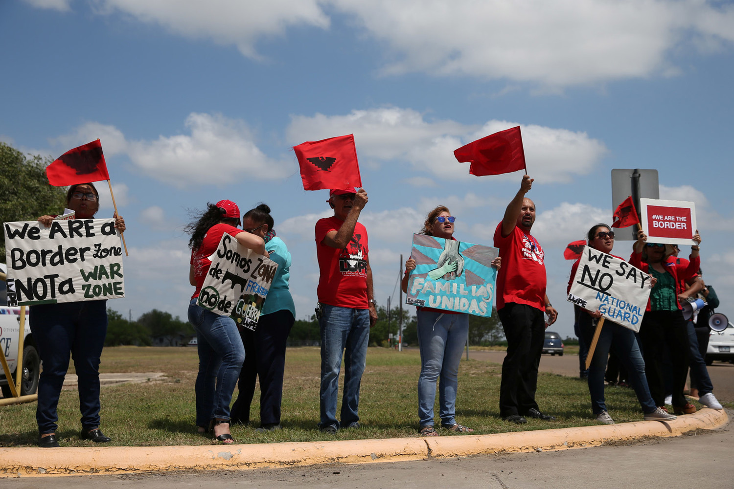 Demonstrators protest the deployment of National Guard troops to the U.S.-Mexico border April 12 before an appearance by Texas Gov. Greg Abbott at Sergeant Tomas Garces Texas Army National Guard Armory in Weslaco, Texas.